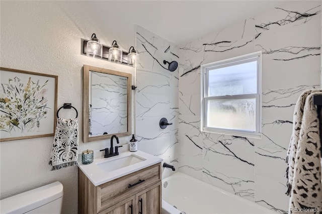 full bathroom with vanity, toilet, and tiled shower / bath combo