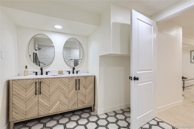 bathroom with hardwood / wood-style flooring and vanity