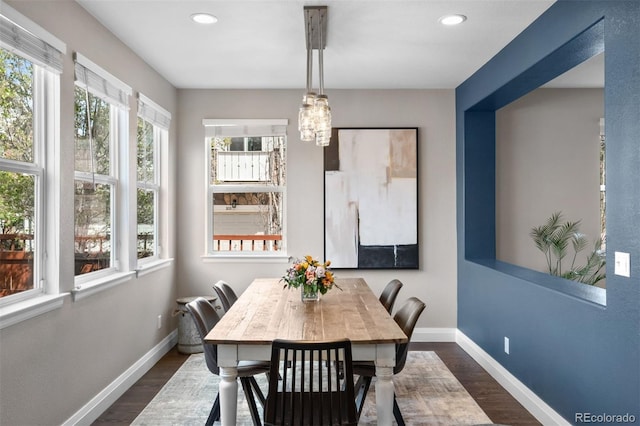 dining area featuring dark wood-style flooring, baseboards, and recessed lighting