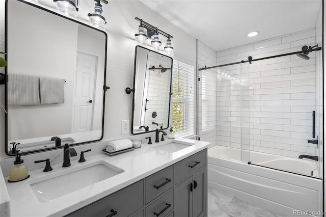 full bath with a sink, double vanity, shower / bath combination with glass door, and marble finish floor