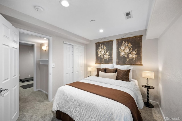 bedroom featuring carpet flooring, a closet, visible vents, and baseboards