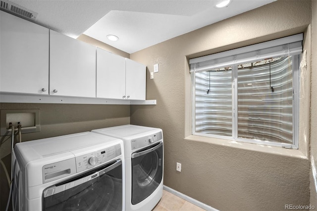 laundry area with cabinet space, visible vents, washer and dryer, and recessed lighting