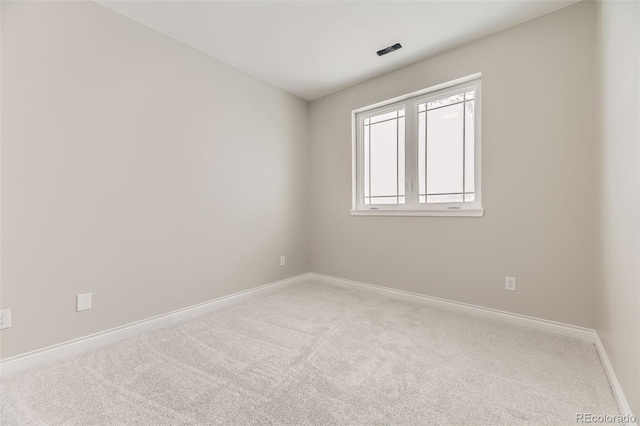 spare room featuring carpet