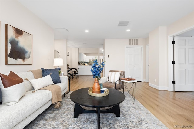 living room with light hardwood / wood-style floors