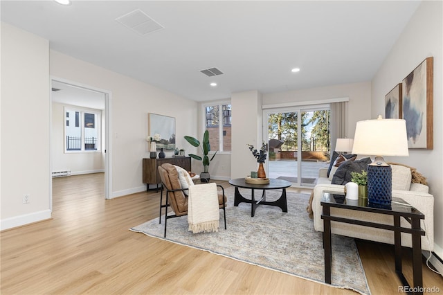 living room with light hardwood / wood-style floors