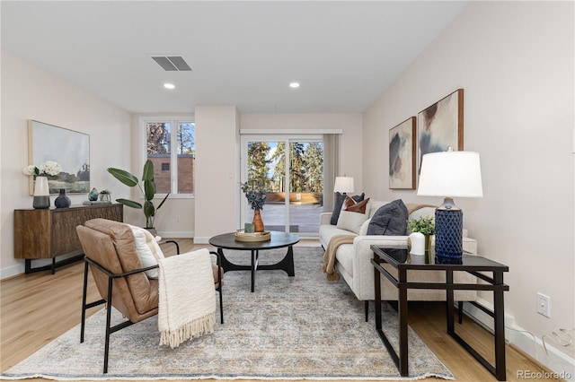 living room with light hardwood / wood-style flooring