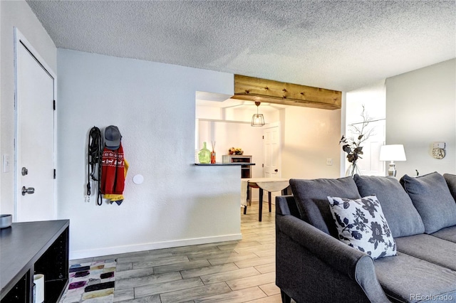 living room with wood-type flooring and a textured ceiling