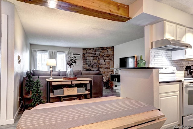 interior space with wood-type flooring and a textured ceiling