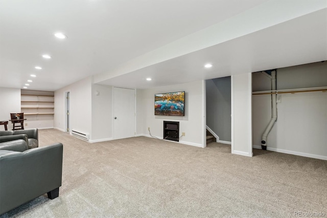 carpeted living area with recessed lighting, stairway, baseboard heating, and baseboards