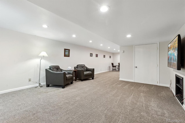 living area featuring carpet flooring, baseboards, and recessed lighting