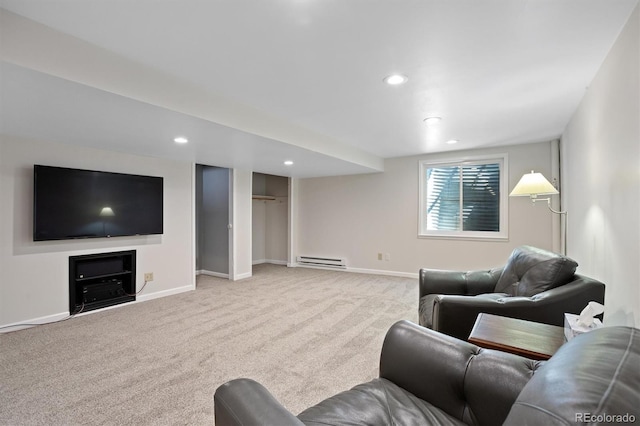 living room featuring a baseboard heating unit, baseboards, carpet flooring, and recessed lighting