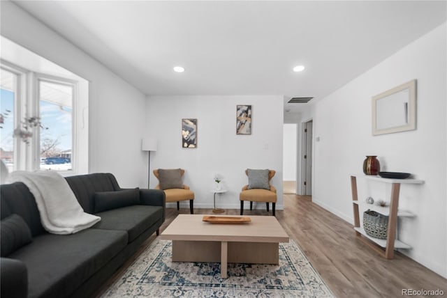 living room with light hardwood / wood-style flooring