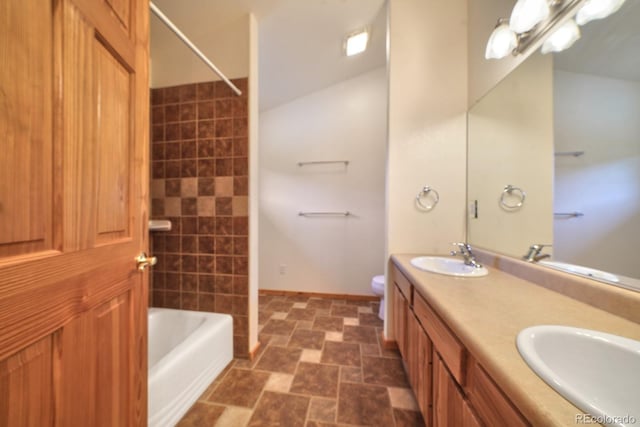 270 River Run Dr, Antonito, CO 81120 - full bathroom featuring double vanity, tub / shower combination, and stone finish flooring