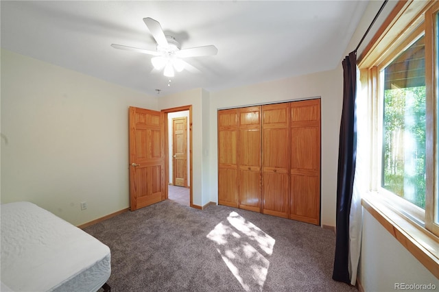 270 River Run Dr, Antonito, CO 81120 - unfurnished bedroom featuring multiple windows, carpet, a closet, and a ceiling fan