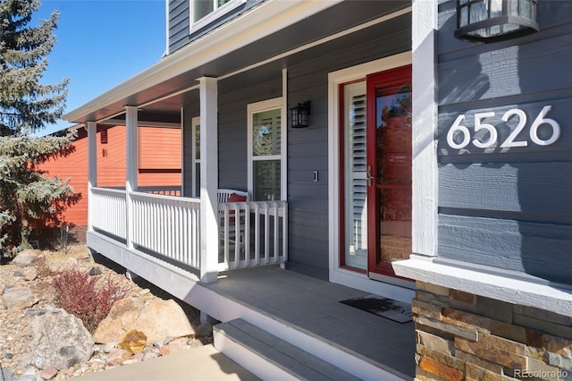 entrance to property featuring covered porch