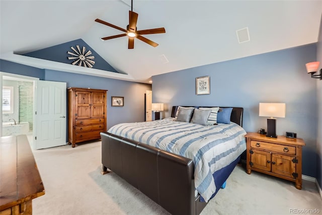 bedroom featuring a ceiling fan, connected bathroom, light colored carpet, and high vaulted ceiling