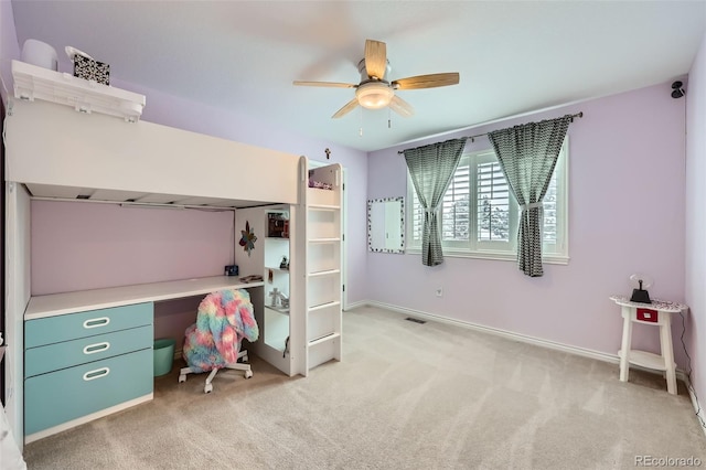 bedroom with visible vents, baseboards, light colored carpet, and ceiling fan