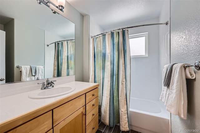 full bathroom featuring vanity and shower / bath combo with shower curtain