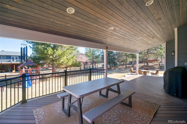 deck with grilling area and playground community