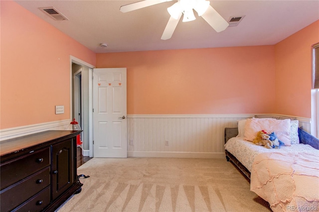 sitting room with ceiling fan and light carpet