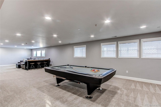 recreation room featuring indoor bar, billiards, and light carpet