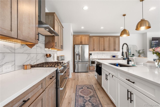 9140 Moondance Dr, Littleton, CO 80125 - kitchen featuring appliances with stainless steel finishes, wall chimney exhaust hood, a sink, decorative backsplash, and light countertops