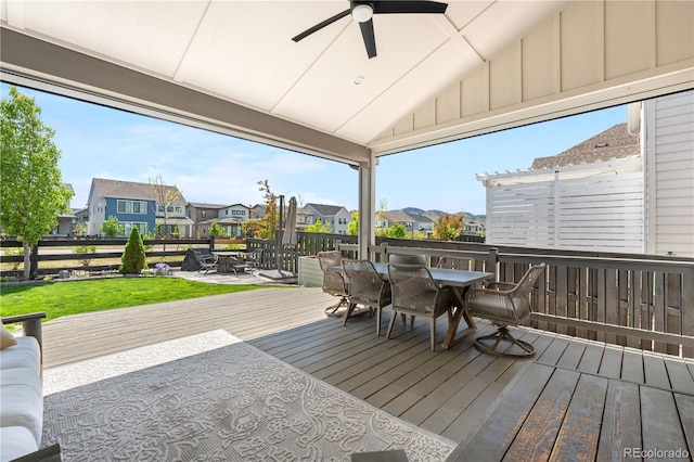 9140 Moondance Dr, Littleton, CO 80125 - wooden terrace featuring outdoor dining space, a residential view, ceiling fan, and a lawn