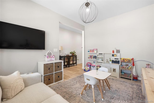 9140 Moondance Dr, Littleton, CO 80125 - playroom with wood finished floors and baseboards