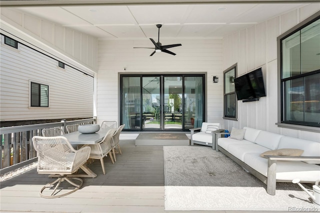 9140 Moondance Dr, Littleton, CO 80125 - wooden terrace with a ceiling fan and an outdoor hangout area
