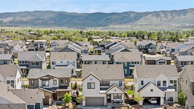 9140 Moondance Dr, Littleton, CO 80125 - aerial perspective of suburban area with a mountainous background