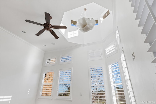 room details with a ceiling fan, visible vents, and crown molding