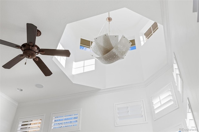 room details with ceiling fan, visible vents, and crown molding