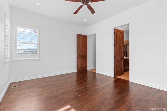 empty room with baseboards, visible vents, dark wood-style floors, ceiling fan, and recessed lighting