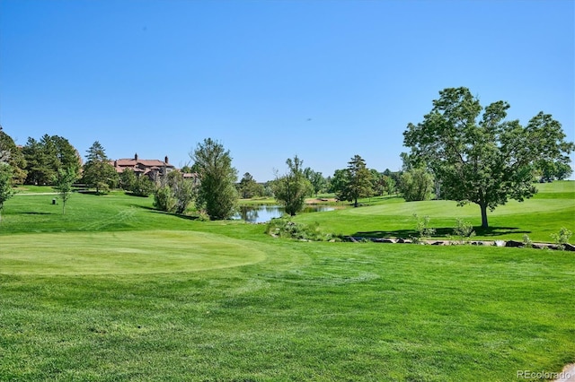 7882 Vallagio Ln, Englewood, CO 80112 - surrounding community with view of golf course, a water view, and a lawn
