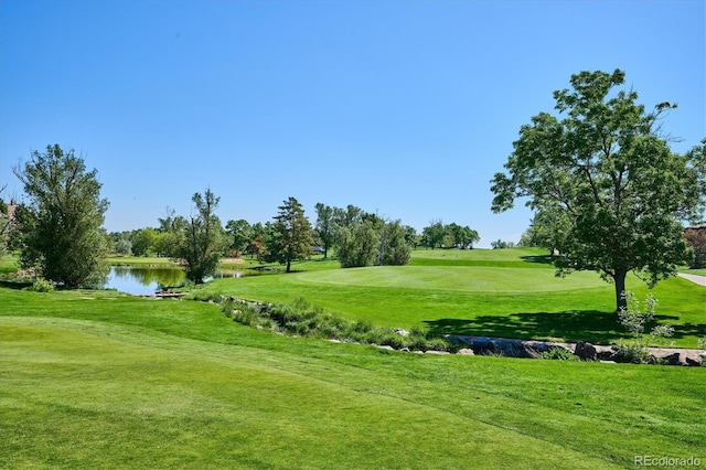 7882 Vallagio Ln, Englewood, CO 80112 - view of community with golf course view, a water view, and a yard