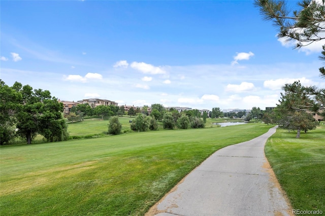 7882 Vallagio Ln, Englewood, CO 80112 - view of community featuring a yard, a water view, and view of golf course