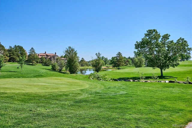 7882 Vallagio Ln, Englewood, CO 80112 - view of property's community featuring golf course view, a water view, and a lawn