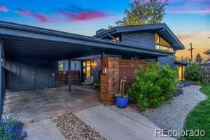 exterior space with a carport