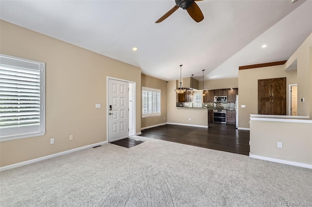 2761 W 106th Loop Unit C, Denver, CO 80234 - unfurnished living room with dark carpet, a ceiling fan, lofted ceiling, baseboards, and recessed lighting