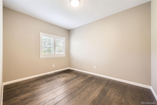 2761 W 106th Loop Unit C, Denver, CO 80234 - empty room featuring baseboards and dark wood-style floors