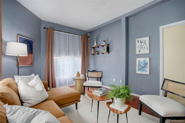 sitting room with hardwood / wood-style flooring