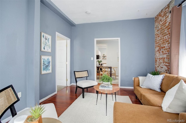 sitting room featuring dark wood-type flooring