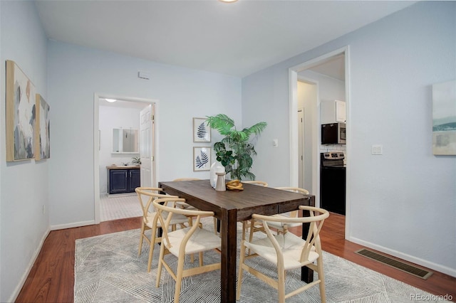 dining room featuring wood-type flooring