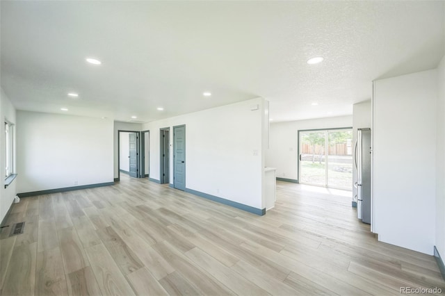 7810 Larkwood St, Commerce City, CO 80022 - spare room featuring light wood-type flooring and recessed lighting
