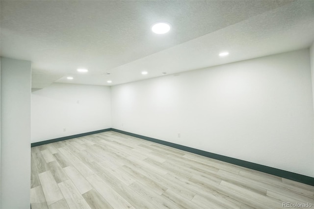 7810 Larkwood St, Commerce City, CO 80022 - empty room featuring light wood-style floors, recessed lighting, and a textured ceiling