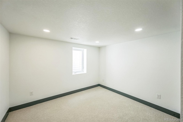 7810 Larkwood St, Commerce City, CO 80022 - empty room featuring recessed lighting, carpet floors, and a textured ceiling