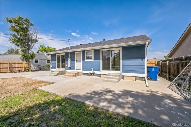 7810 Larkwood St, Commerce City, CO 80022 - back of house featuring a patio and entry steps