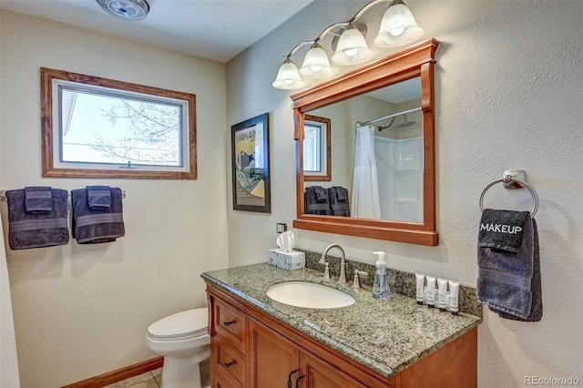 full bath featuring toilet, vanity, and a shower with curtain