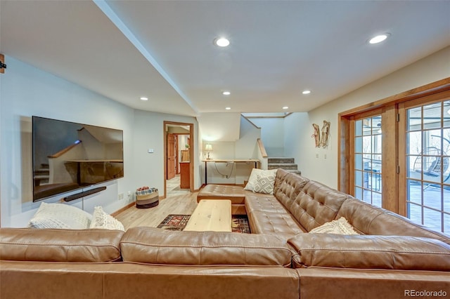 living area with stairs, baseboards, wood finished floors, and recessed lighting