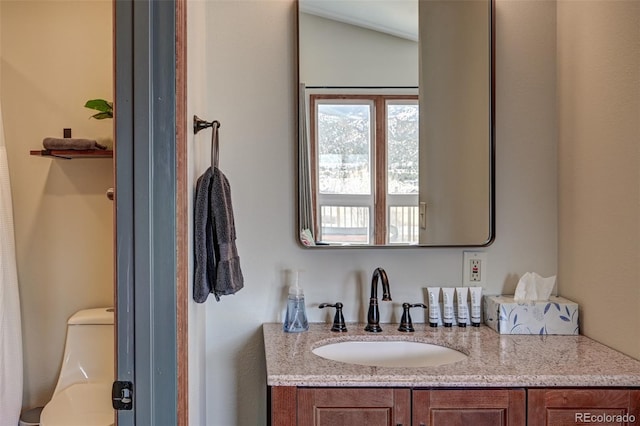 bathroom with vanity and toilet